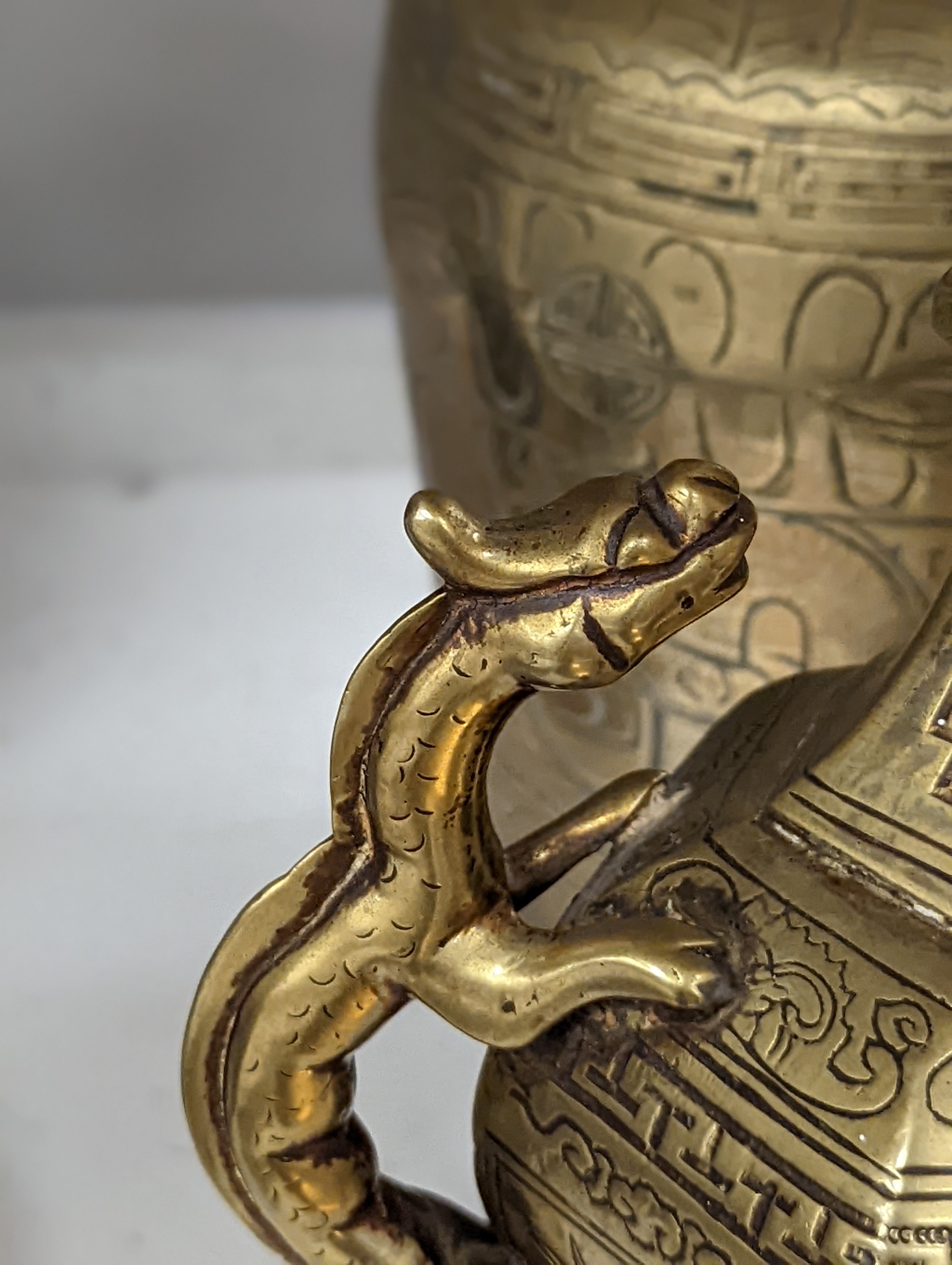 Two early 20th century Chinese bronze vases and a similar tray, 35cm diam.
